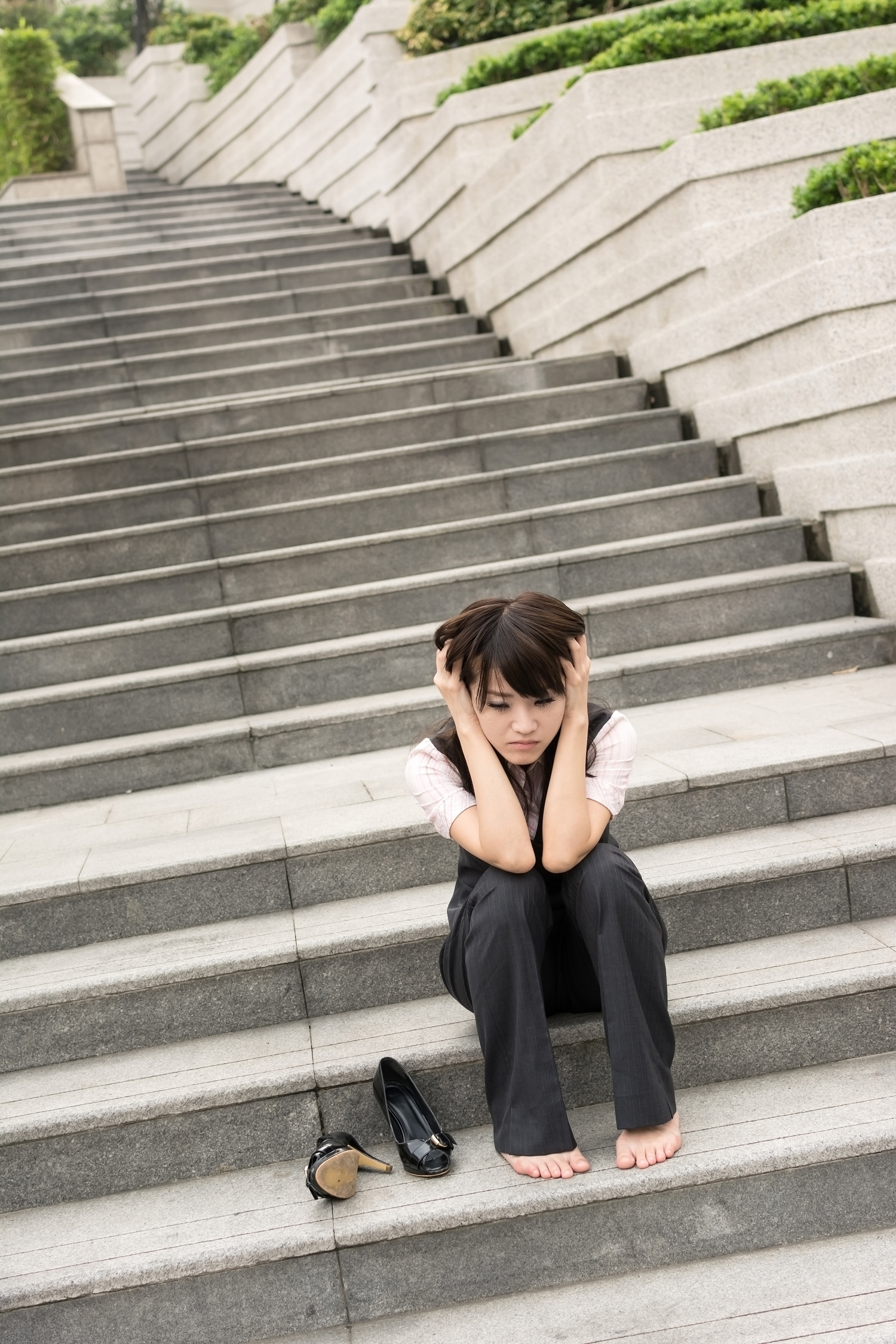 Worried Businesswoman in Stairs